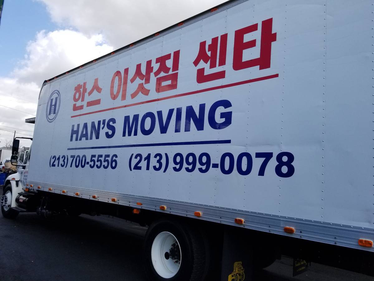 Han's Moving box truck with the company name and phone numbers on the side